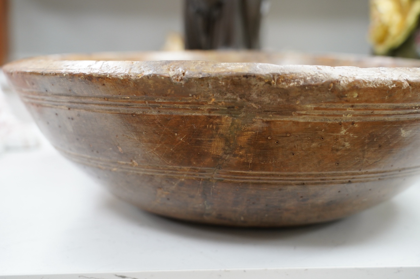 An 18th/19th century sycamore mixing bowl and a smaller bowl, largest 44cm diameter. Condition - poor